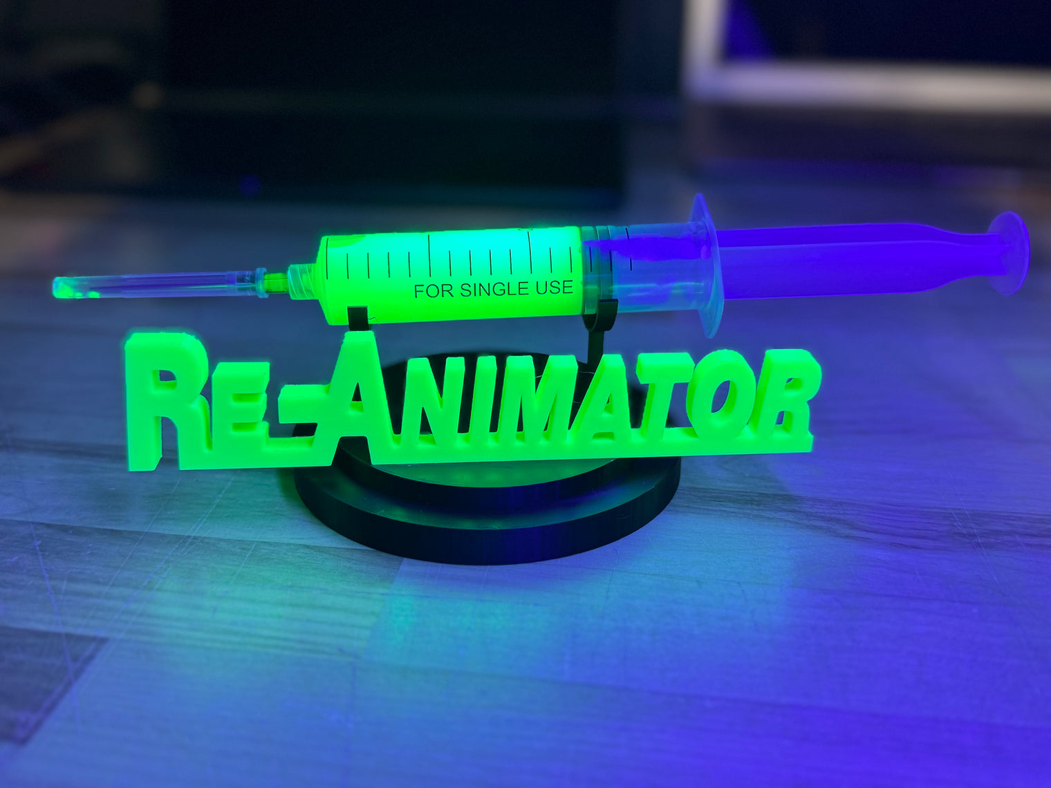 Re-Animator - UV Reactive Re-Agent with Glow in the Dark Logo Stand
