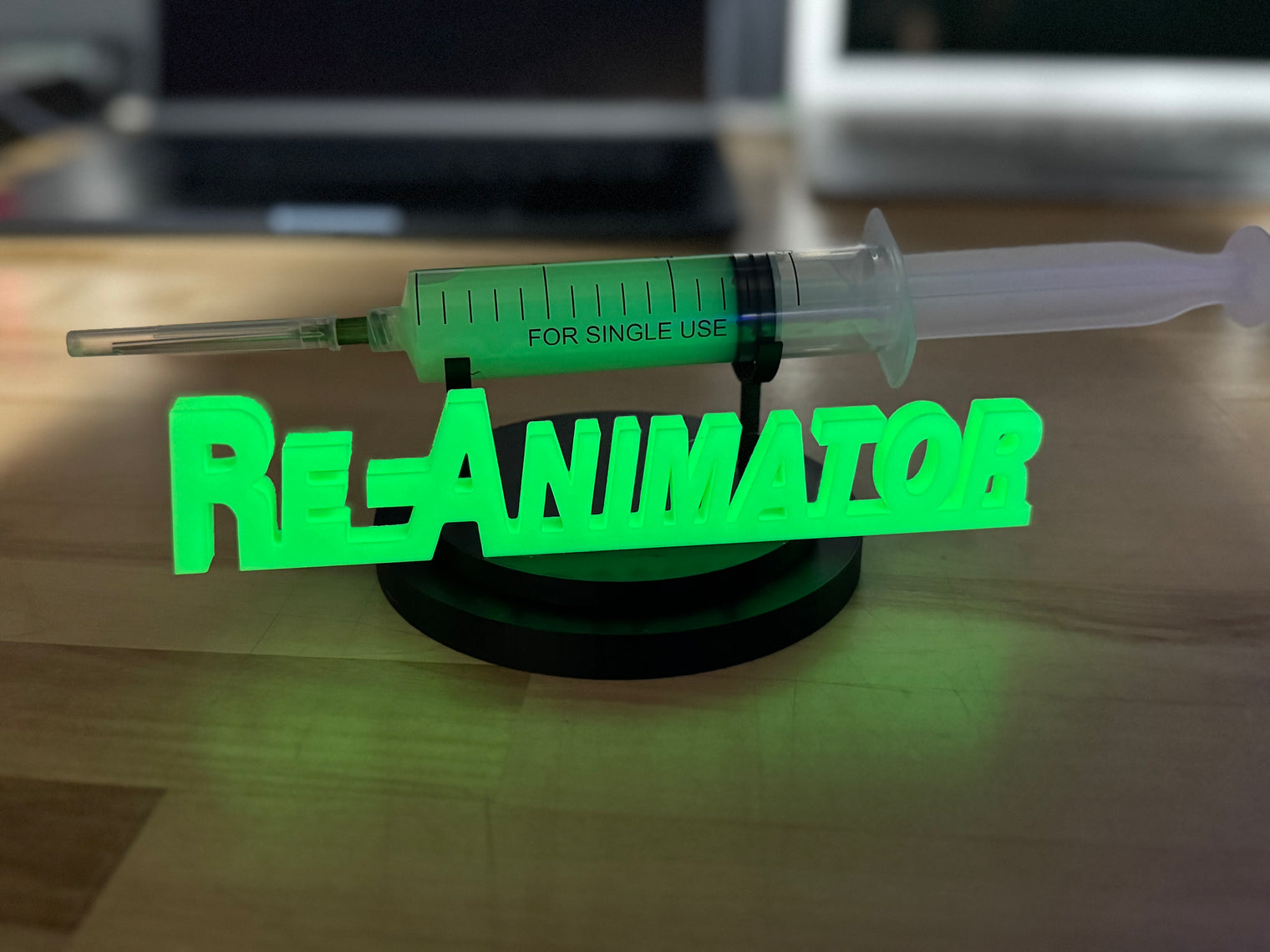 Re-Animator - UV Reactive Re-Agent with Glow in the Dark Logo Stand