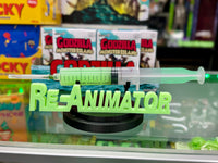 Re-Animator - UV Reactive Re-Agent with Glow in the Dark Logo Stand